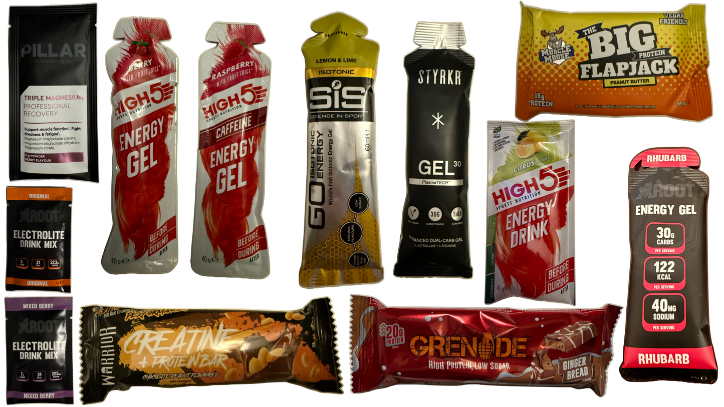 mix box gels, running, racing, styrkr, pillar recovery drink, premium running products, grenade protein snack, active roots gel, high 5 caffeine gels, drinks, running nutrition all spread out