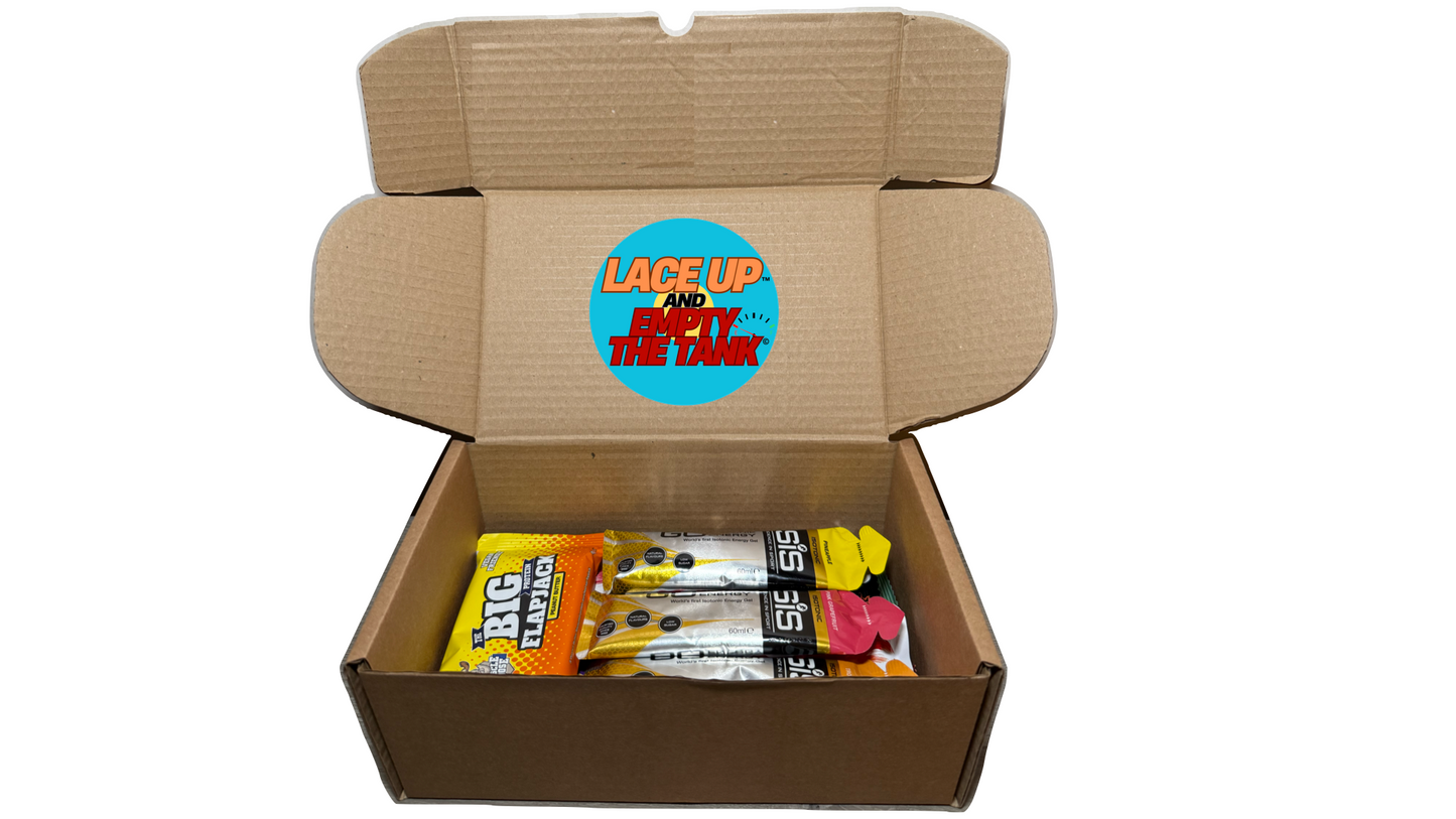 protein and gel box with running gels, and high protein snacks, muscle moose, uncle jack flapjack, SIS, High 5, yubi bar, Grenade protein bars, Warrior creatine bars, High 5 caffeine gels and high 5 energy, packaged up